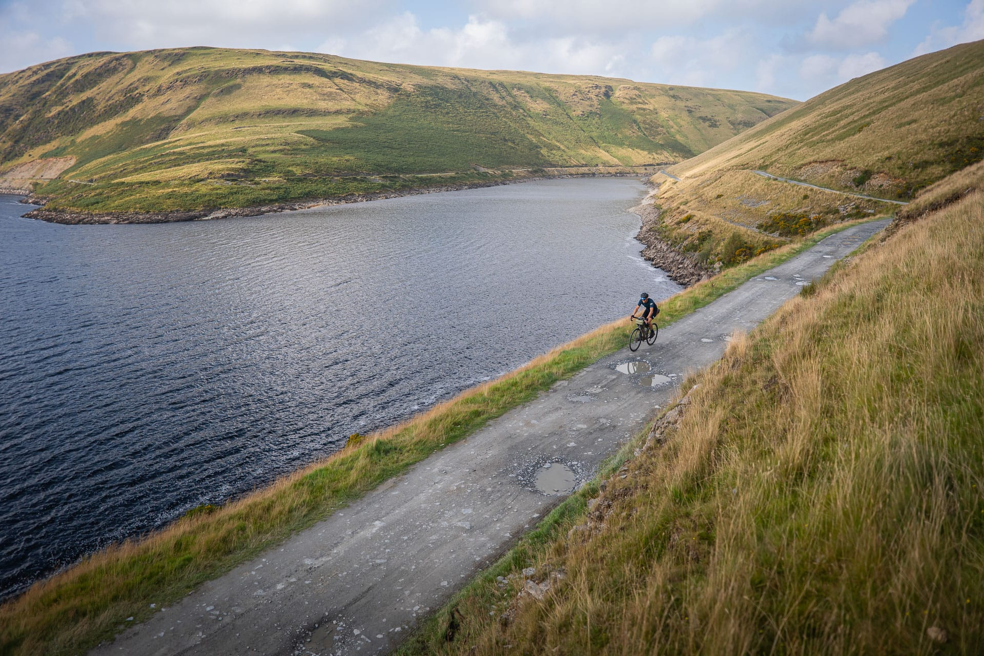 A rider on the gravel road along the Claerwen reservoir