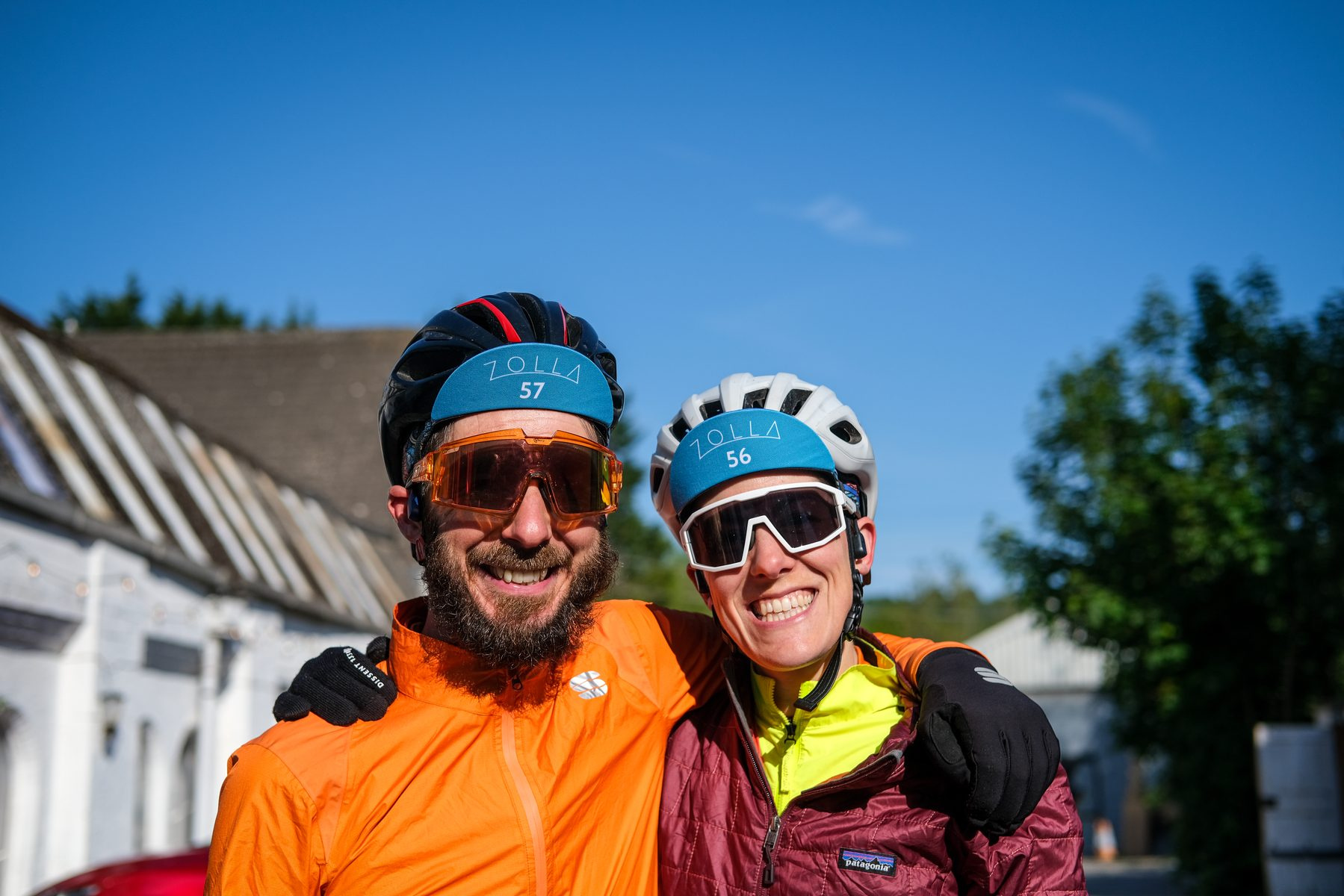 Two riders grinning on the start morning