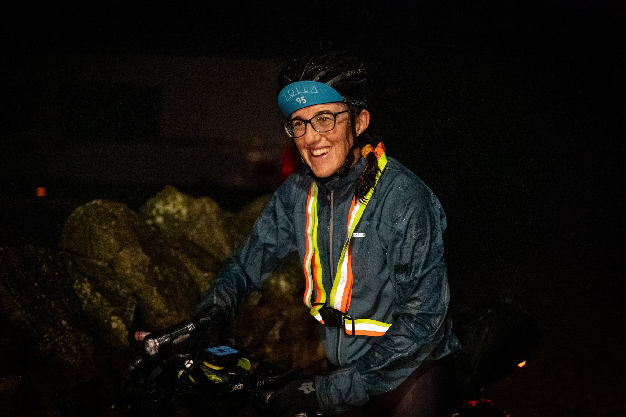 A smiling rider arriving at the finish at Llwyn Celyn in the dark before dawn