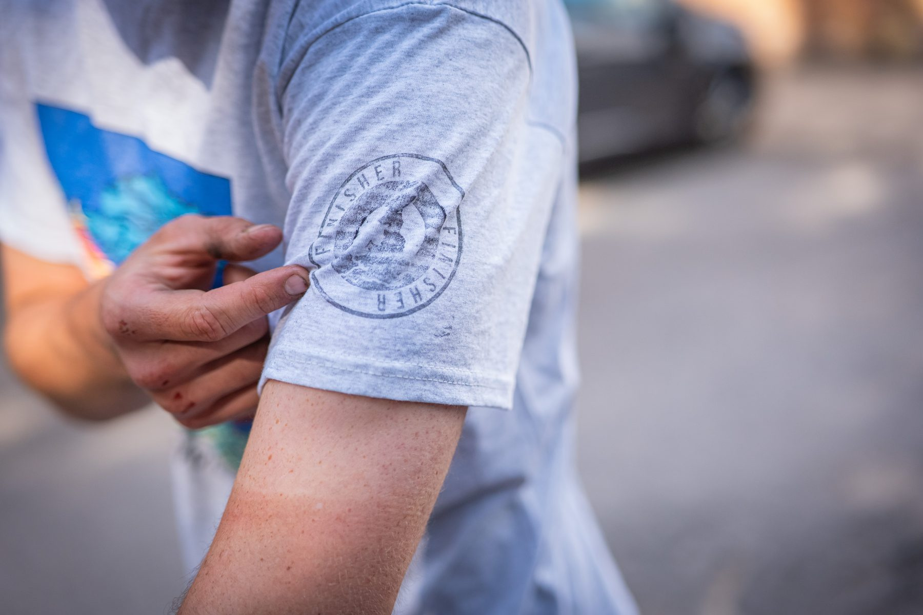 A finisher's t-shirt being stamped at the finish